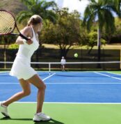 people playing tennis in tropics