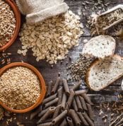 Wholegrain food still life shot on rustic wooden table